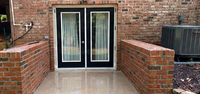 Clean brick patio and entryway after pressure washing