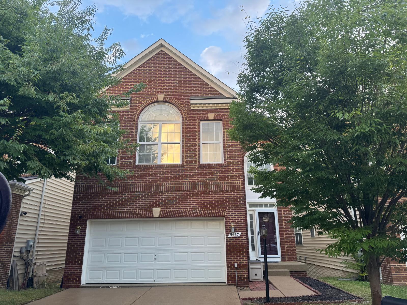 Clean red brick home with arched window