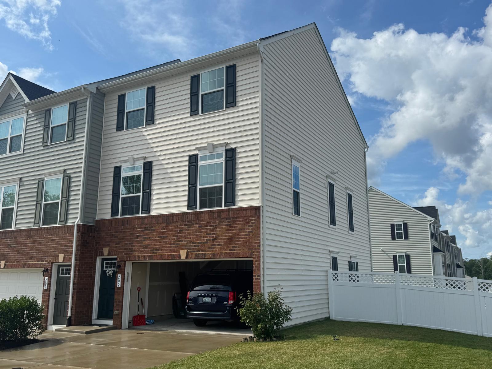 Clean white vinyl siding townhome